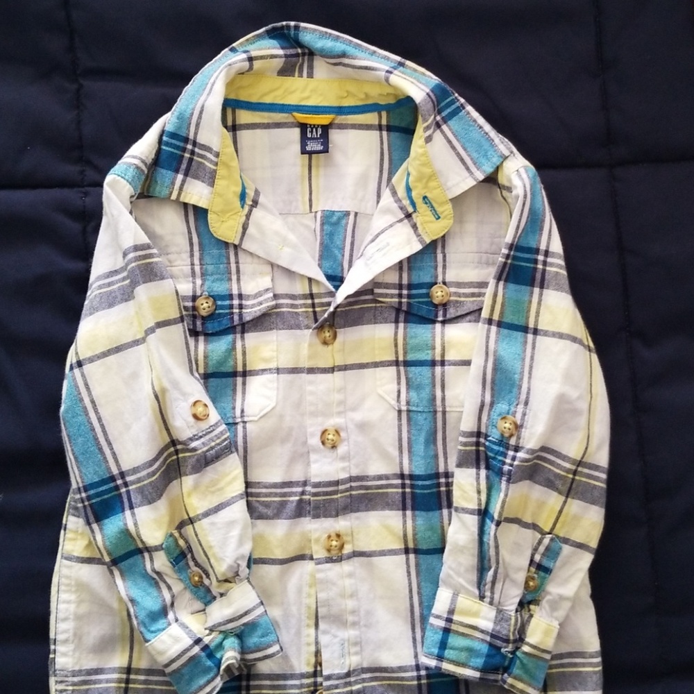 Two boys shirts. Orange and blue plaid.
